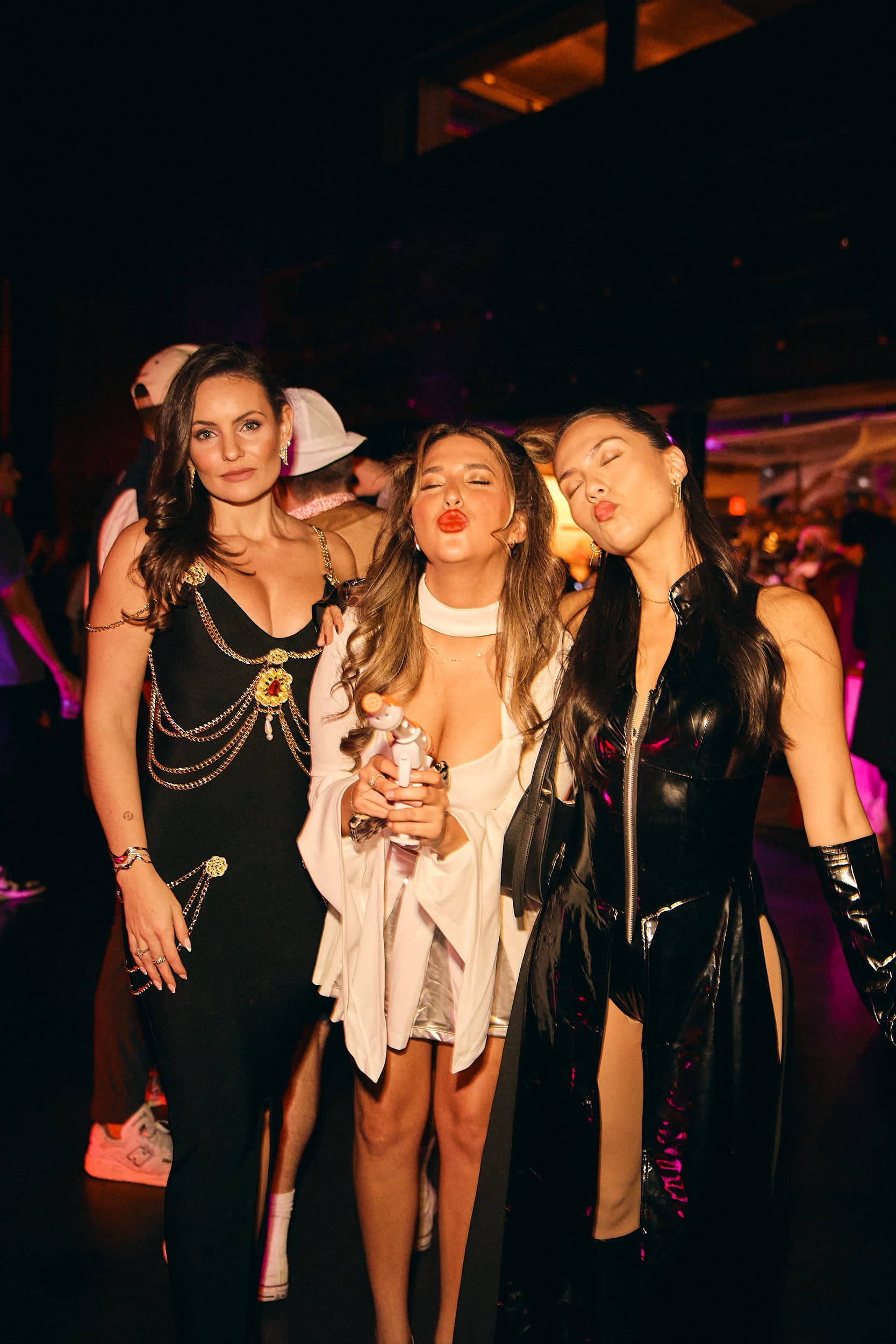 Friends posing together at a Halloween NYC nightlife event